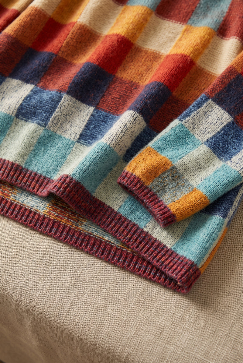 Checkered Merino Turtleneck Sweater in Solid — studio angle