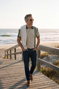 Men Striped Polo Shirt Short Sleeve in Striped Beige Green — lifestyle beach side