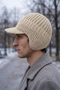 Rib Knit Earflap Beanie in White — studio angle