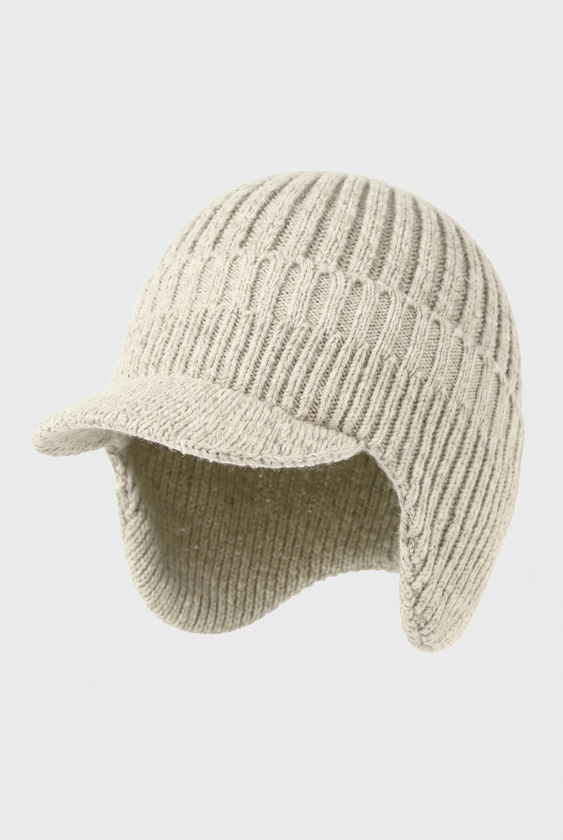 Rib Knit Earflap Beanie in White — studio front